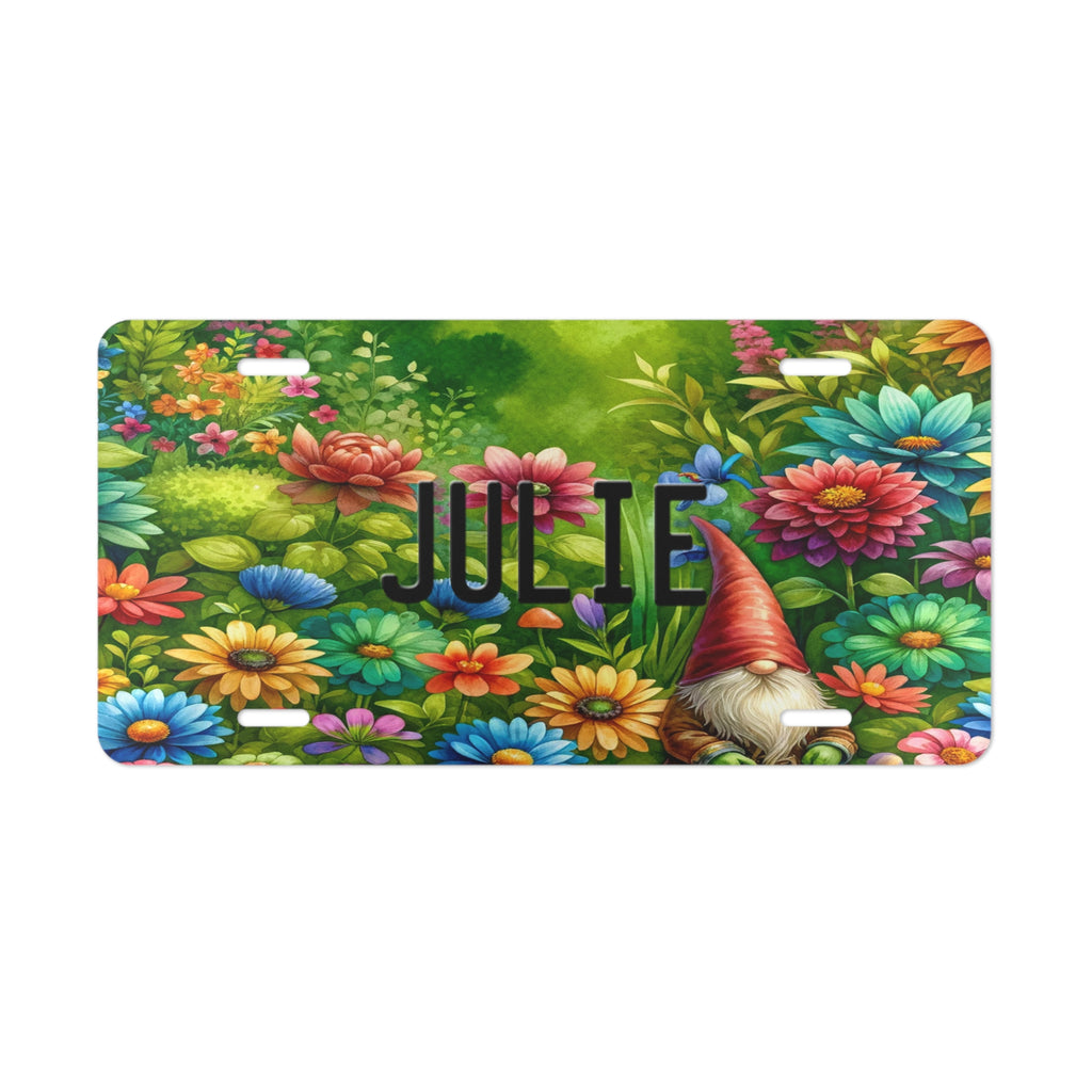 Personalized Gnome Vanity Custom Front License Plate with gnome in a field of flowers n red, blue, teal, and orange. The license plate has your name in black using the same license plate font found on regular state plates.
