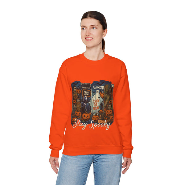 Person wearing an orange sweatshirt with Halloween-themed design on a white background