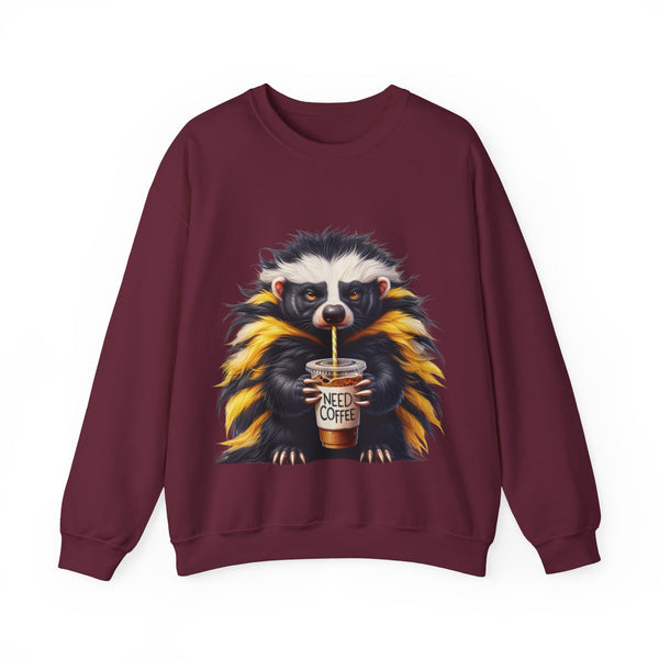 Maroon sweatshirt with a raccoon holding a 'Need Coffee' cup design on a white background