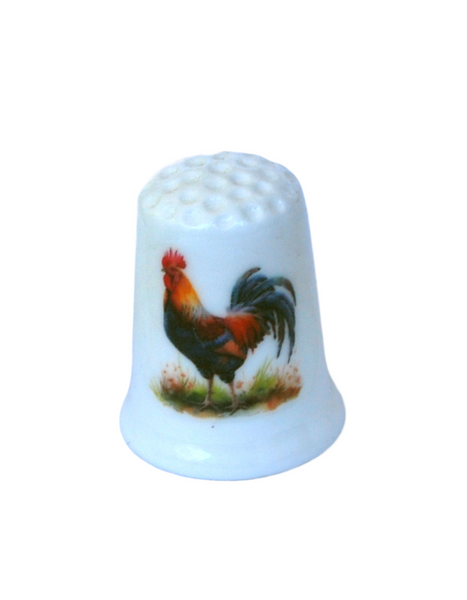Collectible thimble with a rooster on it