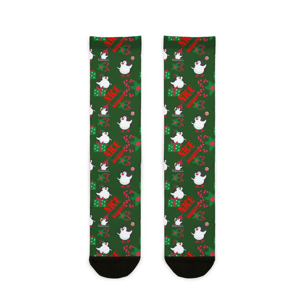 Green socks with festive design featuring birds and text on a white background