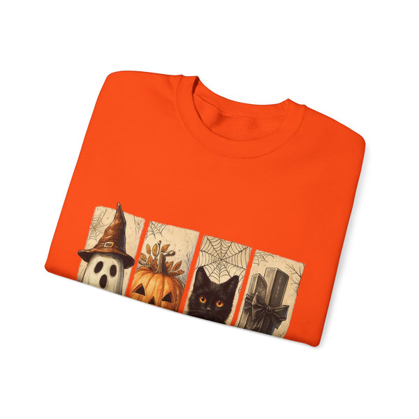 Folded orange t-shirt with Halloween-themed design on a white background