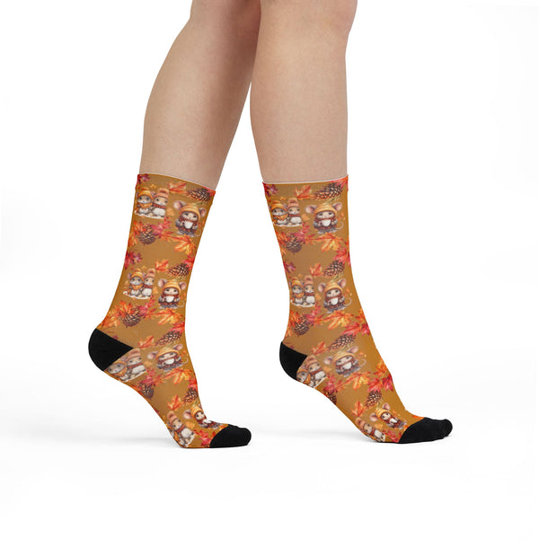 Socks with autumn-themed design worn by a person on a white background