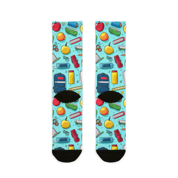 Colorful socks with school-themed pattern on a white background