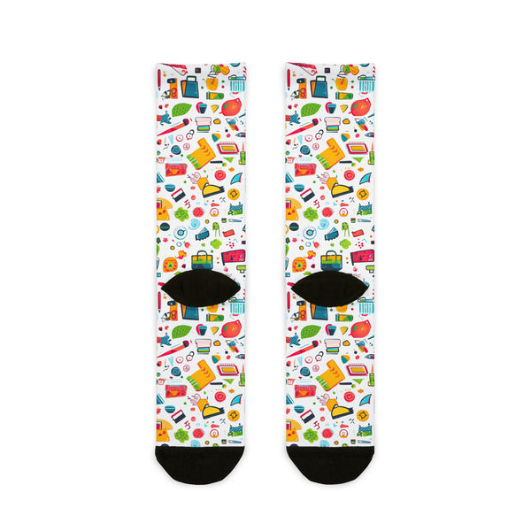 Colorful patterned socks with black toes and heels on a white background