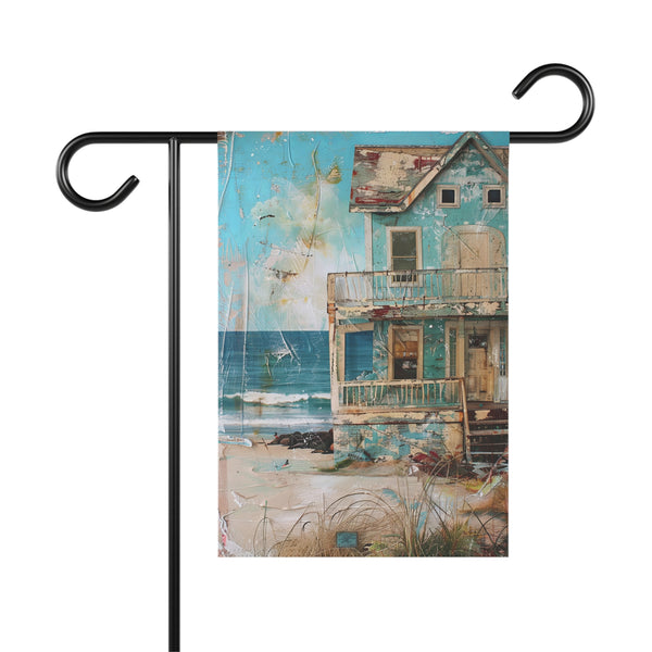Decorative garden flag with a coastal scene featuring a house by the sea.