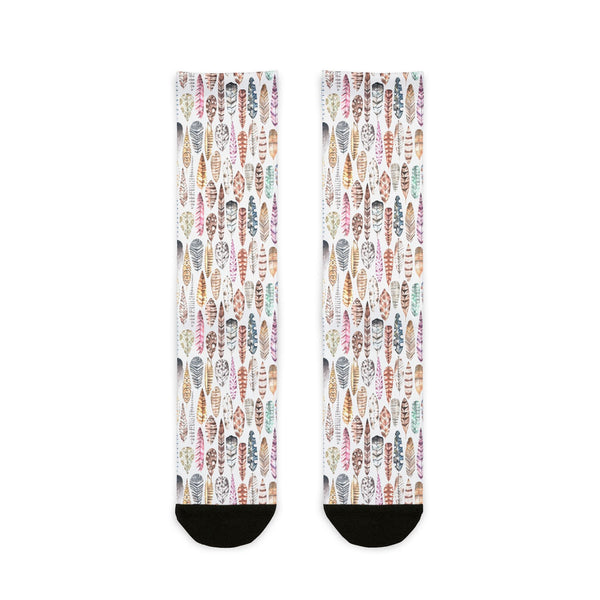 Pair of socks with a colorful feather pattern on a white background