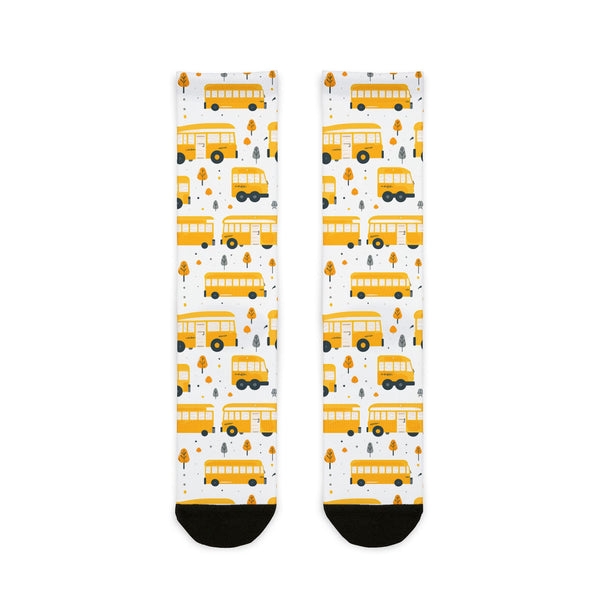 Pair of socks with yellow school bus pattern on a white background