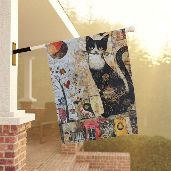 Decorative towel with a cat design hanging on a railing.