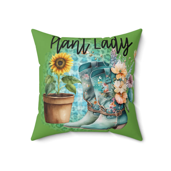 Pillow with cowboy boots, sunflower, and flowers on a green background with 'Plant Lady' text.