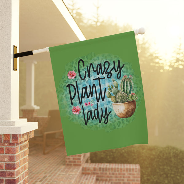Decorative garden flag with 'Crazy Plant Lady' text and cactus design on a pole outdoors.