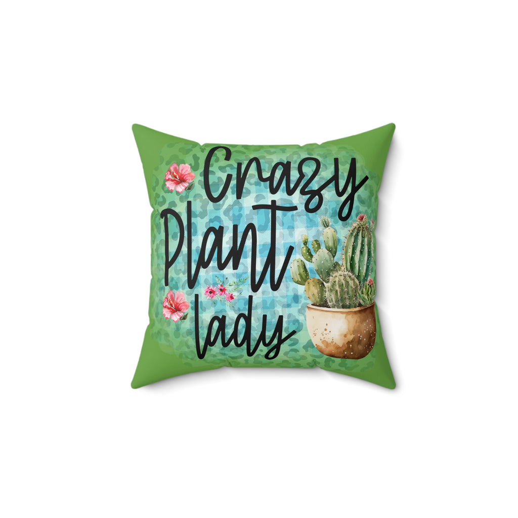 Decorative pillow with 'Crazy Plant Lady' text and cactus design on a green background