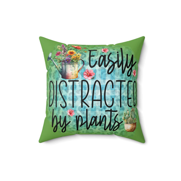 Decorative pillow with plant-themed design and text on a white background