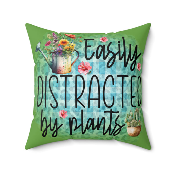 Decorative pillow with plant-themed design and text on a white background