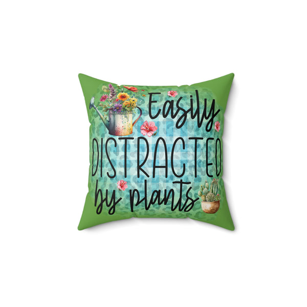 Decorative pillow with plant-themed design and text on a white background