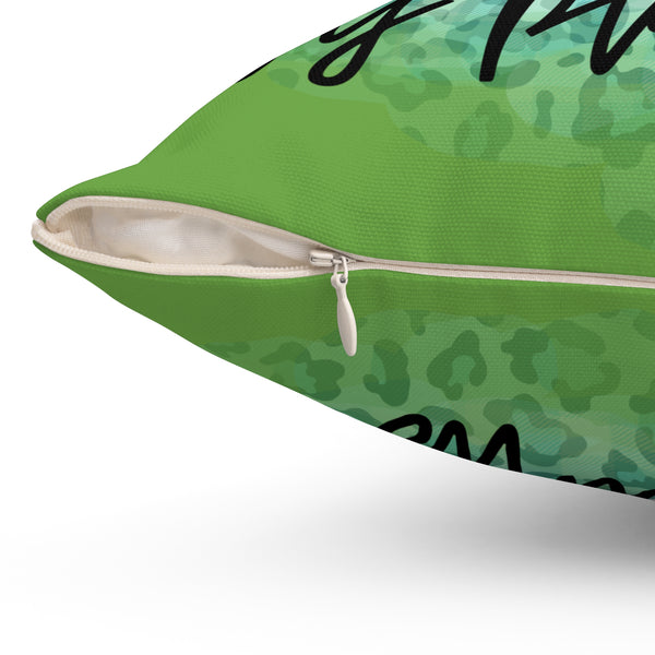 Green pillow with a zipper on a white background