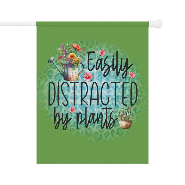 Decorative flag with 'Easily Distracted by Plants' text and gardening elements on a green background.