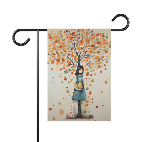 Decorative garden flag with a tree and person design on a white background