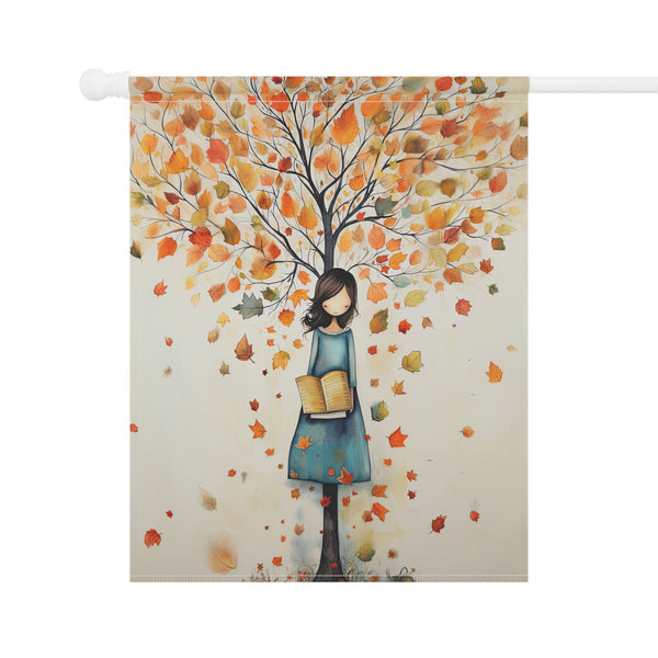 Decorative flag with a design of a woman holding books under an autumn tree.