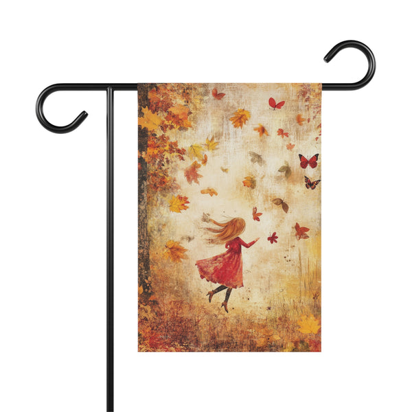 Decorative garden flag with a woman in a red dress and autumn leaves on a stand.