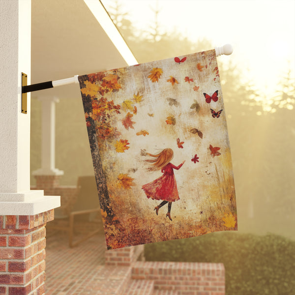 Decorative flag with a girl in a red dress and autumn leaves on a porch.