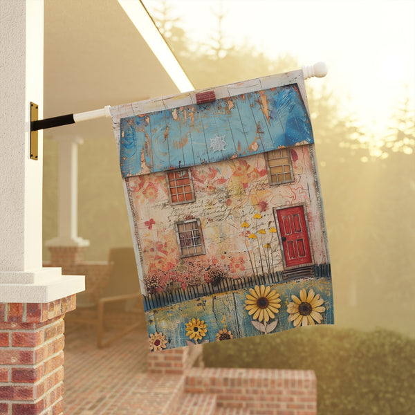 Decorative garden flag with a house design featuring flowers and sunflowers on a porch.