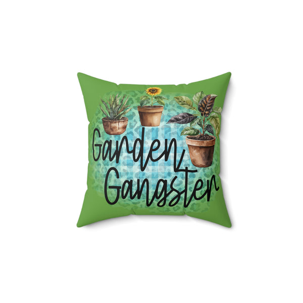 Green pillow with plant illustrations and 'Garden Gangster' text on a white background