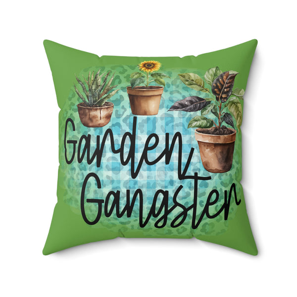 Pillow with 'Garden Gangster' text and potted plants on a green background