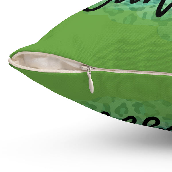 Green pillow with zipper on a white background