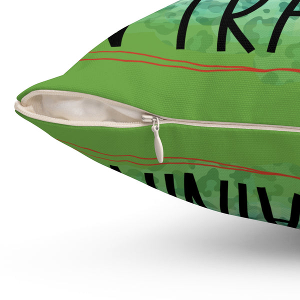 Green pillow with black and red patterns on a white background