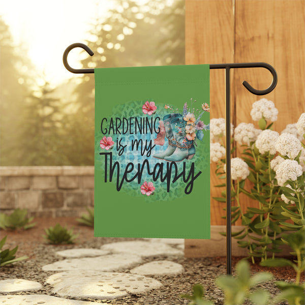 Garden flag with 'Gardening is my Therapy' text and garden-themed design on a stand outdoors.