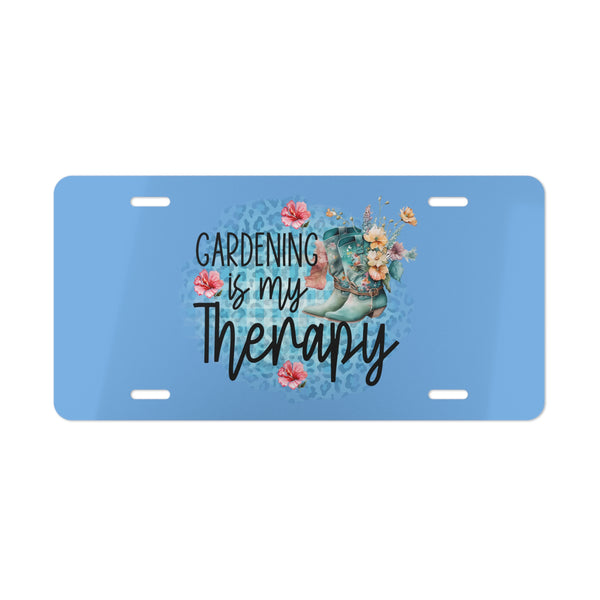 License plate with 'Gardening is my Therapy' text and floral design on a blue background