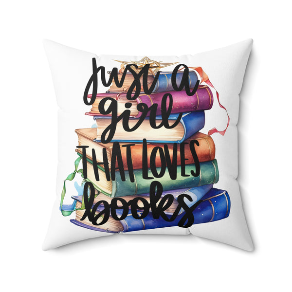 Decorative pillow with books and text 'Just a girl that loves books' on a white background