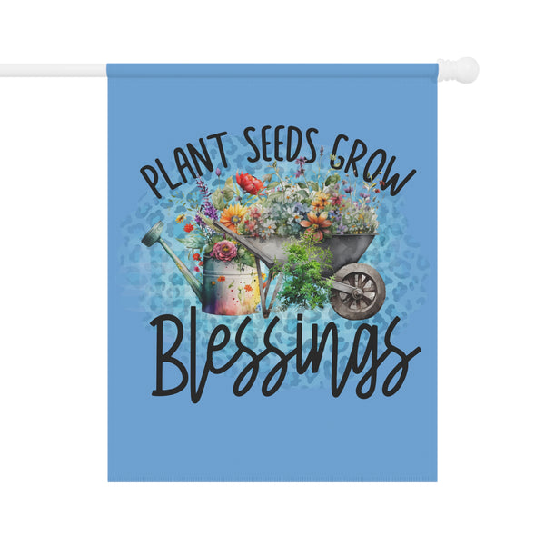 Decorative flag with a wheelbarrow, flowers, and 'Plant Seeds Grow Blessings' text on a blue background.
