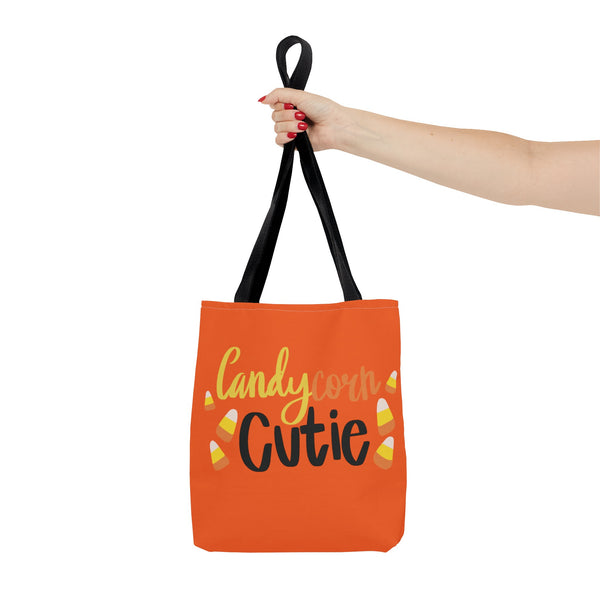 Candy Corn Cute Halloween Trick or Treat Bag being held up by a woman on a white background