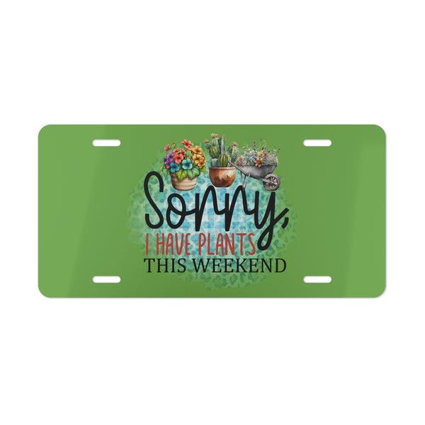 Green license plate with plant-themed design and text on a white background