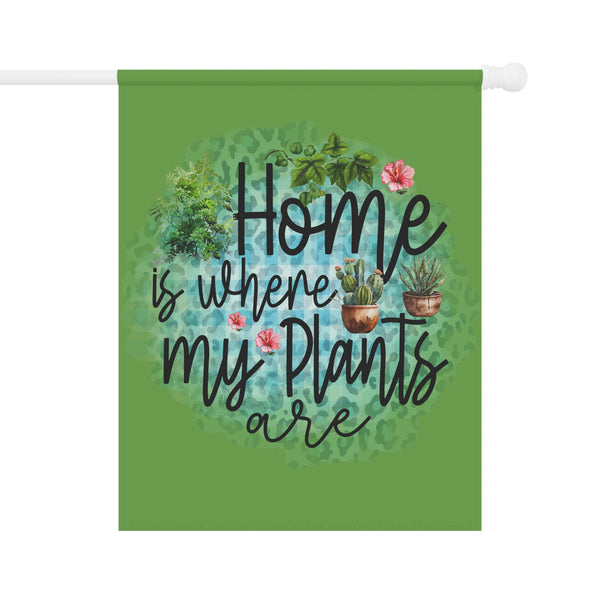 Decorative flag with 'Home is where my plants are' text and plant illustrations on a green background.