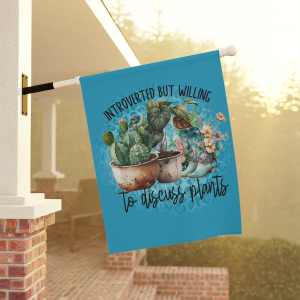 Decorative flag with cacti and plants design on a porch