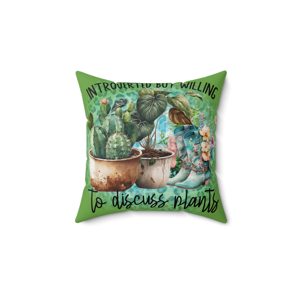 Decorative pillow with cacti, boots, and text on a green background