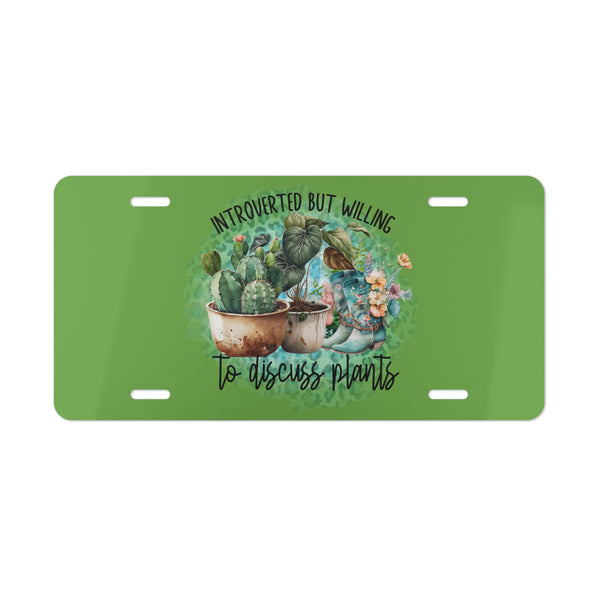 Green license plate with plant-themed design and text on a white background