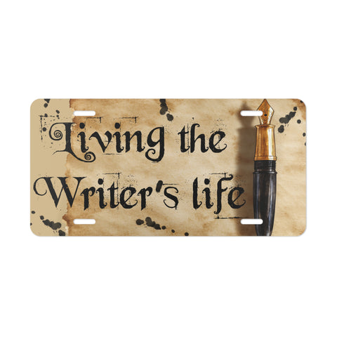 License plate with 'Living the Writer's life' text and a fountain pen on a white background