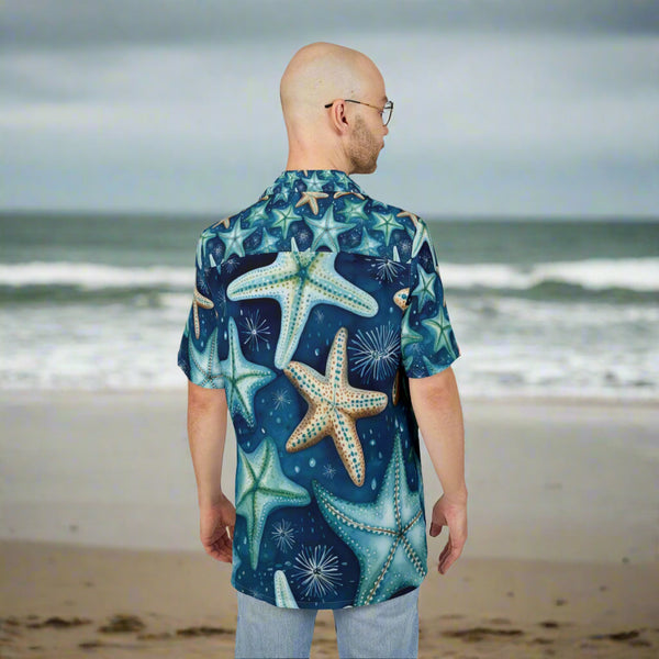 Man wearing a blue starfish patterned shirt on a white background
