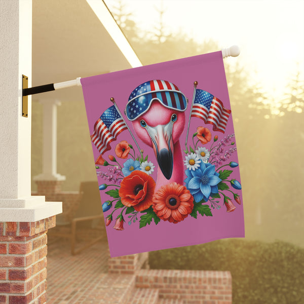 Decorative flag with a flamingo wearing sunglasses and American flags on a pink background, hanging outside.