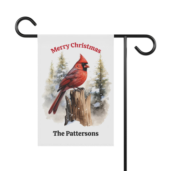 Christmas-themed garden flag with a red cardinal and personalized text on a white background.