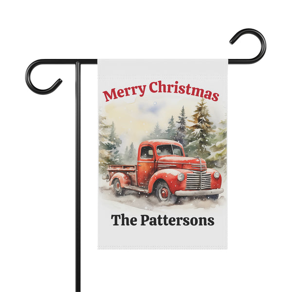 Christmas-themed garden flag with a red truck and 'Merry Christmas The Pattersons' text on a white background.
