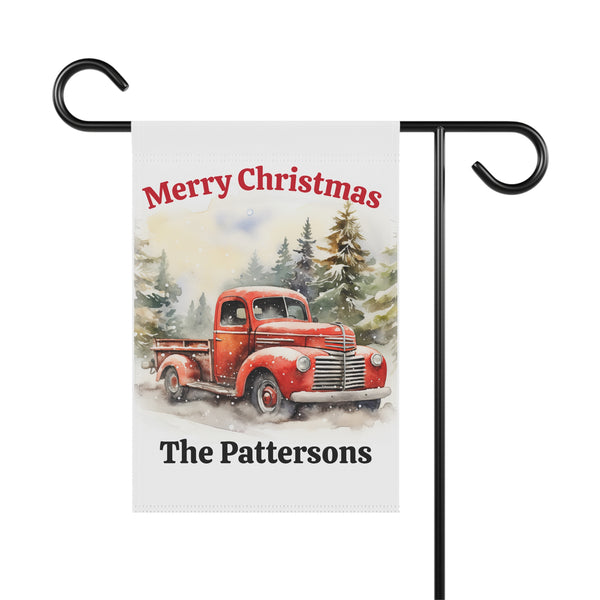 Christmas-themed garden flag with a red truck and 'Merry Christmas' text, personalized with 'The Pattersons'.