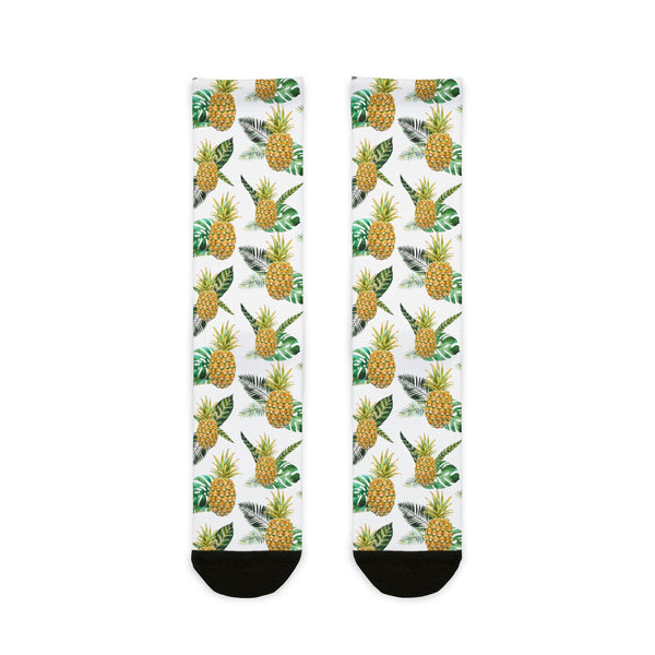 Two socks with pineapple pattern on a white background