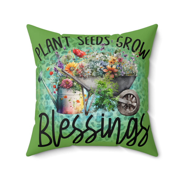 Decorative pillow with gardening theme and text 'Plant seeds grow blessings' on a green background