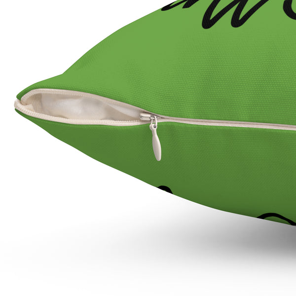Green pillow with a zipper on a white background