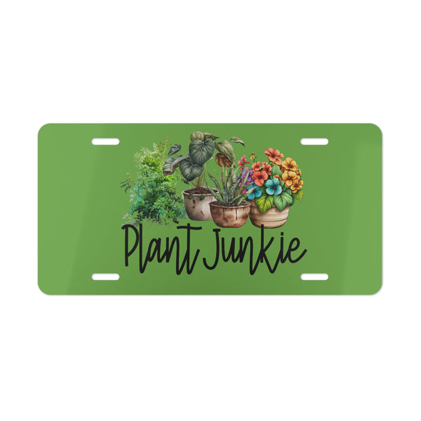 Green license plate with plant designs and 'Plant Junkie' text on a white background